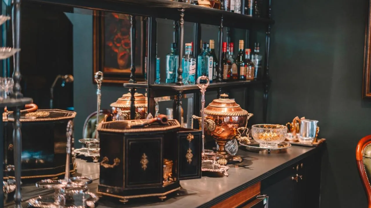 A bar with a counter with many items on it at The Galaxie in Oxford